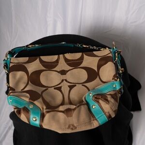Stylish Tan and Brown Women's Coach Bag with Teal Accents